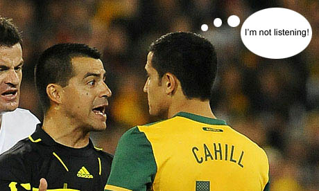 Tim Cahill, right, is reprimanded by the referee for his tackle on Leo Bertos during Australia’s win over New Zealand. Photograph: Paul Crock/AFP/Getty Images